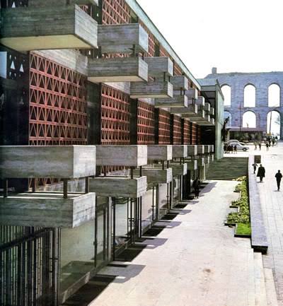 Terraced concrete structure of the İstanbul Manifaturacılar Çarşısı with the Valens Aqueduct beyond