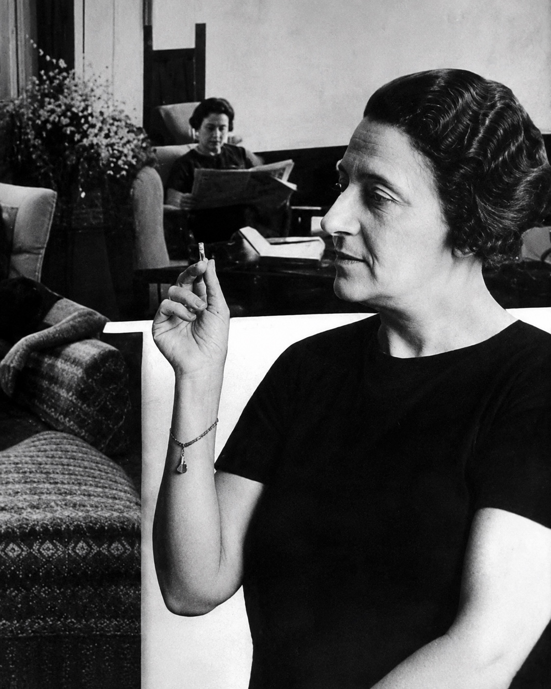 A Turkish woman political thinker photographed in profile in a black-and-white interior