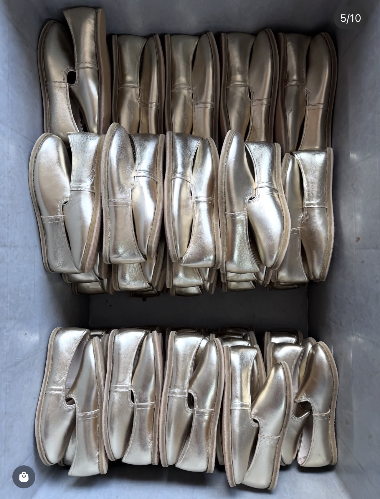 Silver leather yemenis in a workshop crate