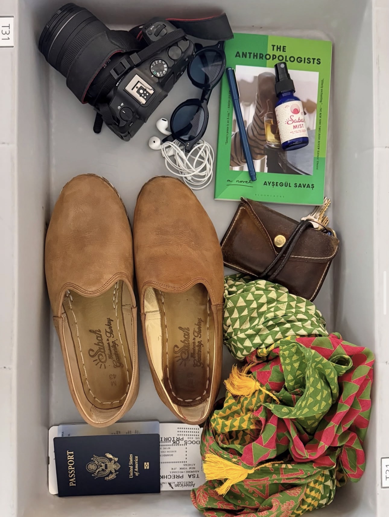 Tobacco leather yemenis in a travel flat lay